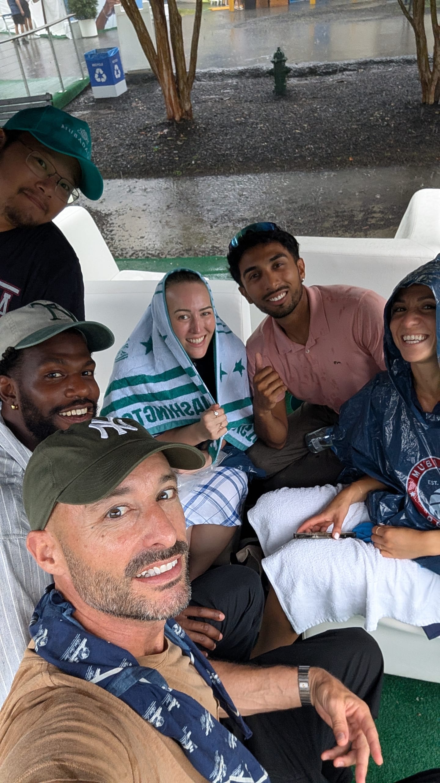The group taking shelter during a rainy day