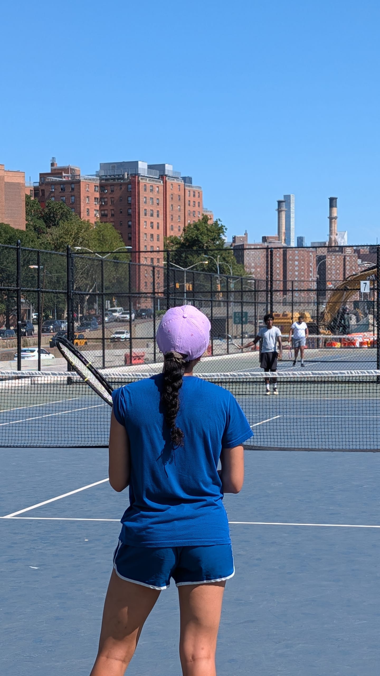 Brian Watkins courts with the Manhattan skyline beyond
