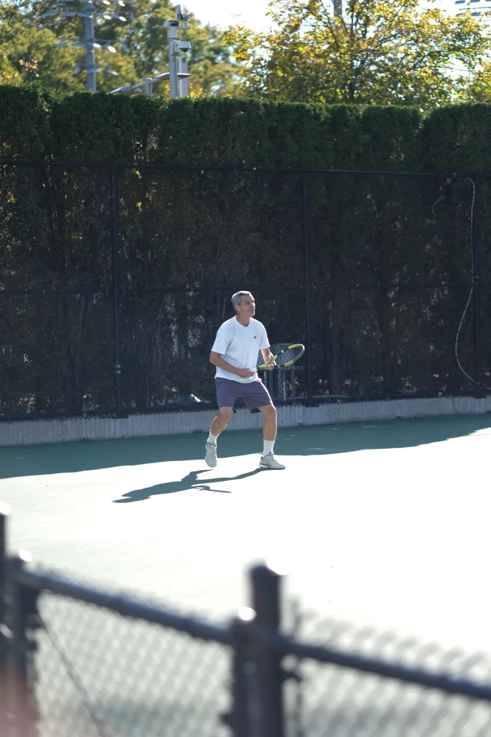 A shot from the baseline in the afternoon light at the 2026 Manhattan Ladder Finals