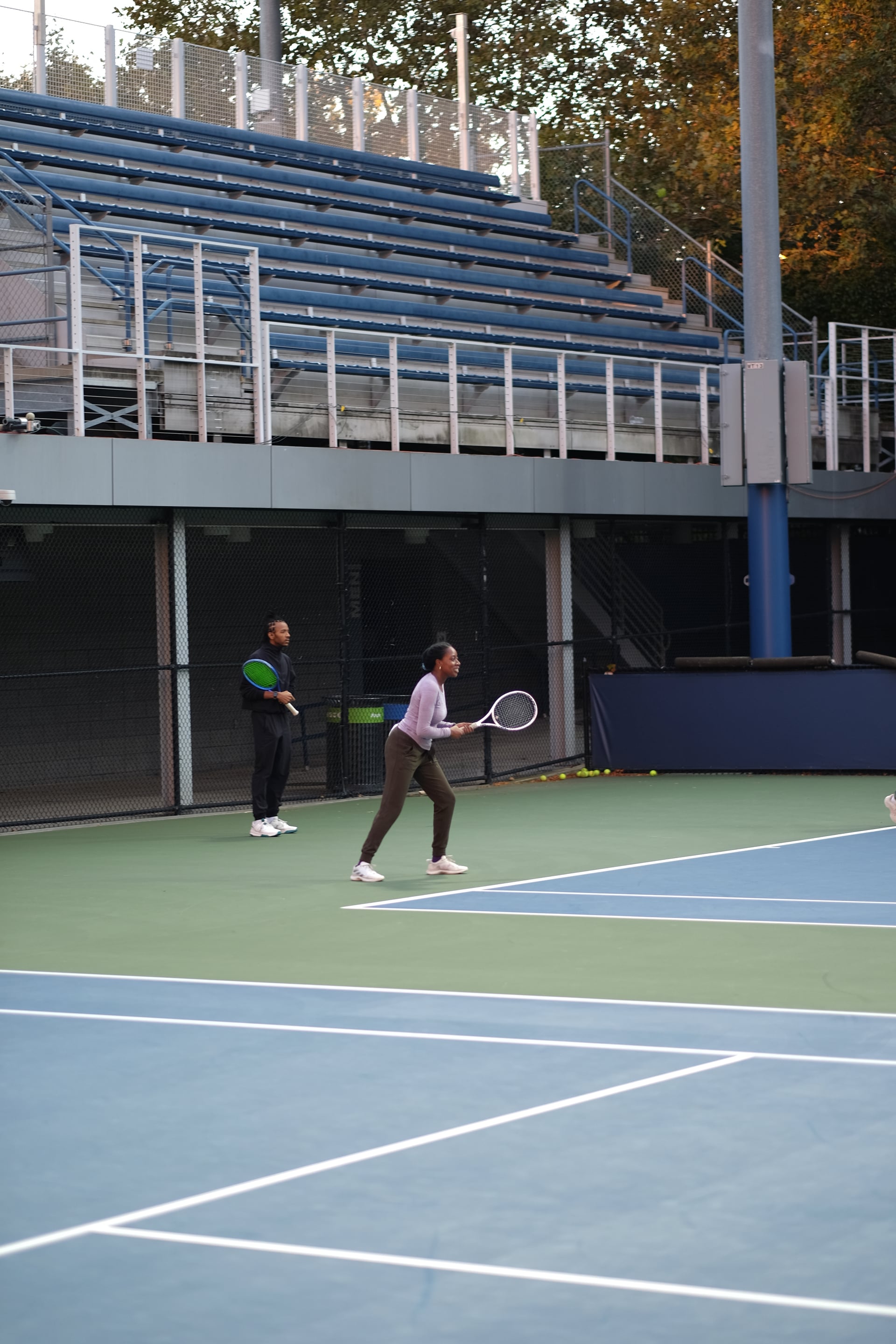 Doubles partners ready to receive on an outdoor practice court at Saturday Sunset Club, October 17, 2026