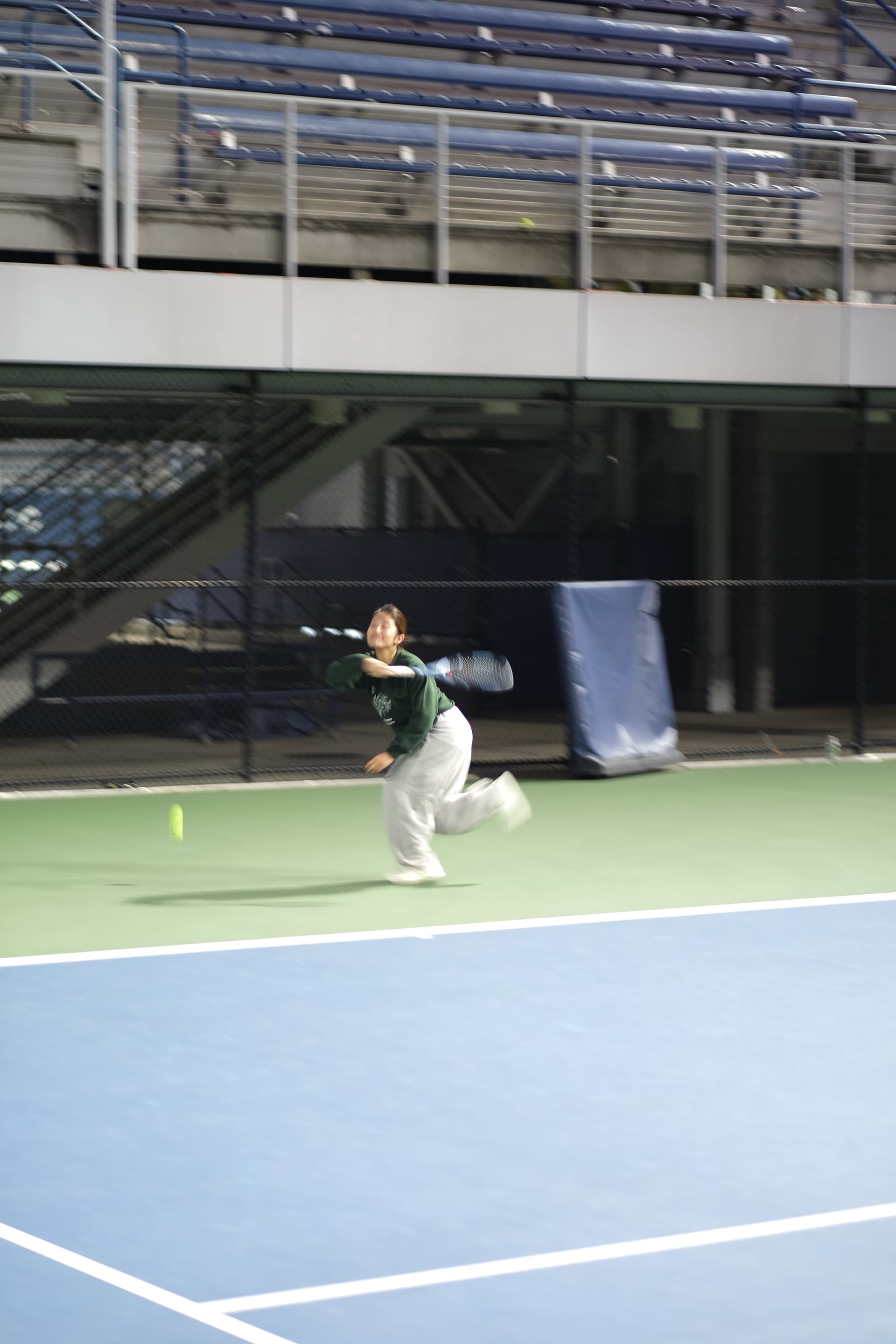 A player stretching to return a ball during a rally at Saturday Sunset Club, October 17, 2026