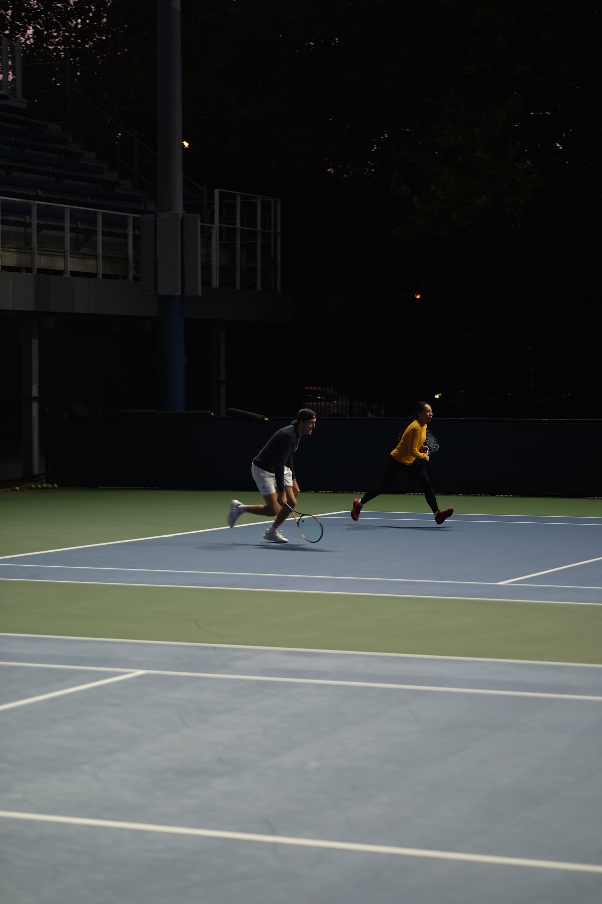 Doubles partners moving forward together as evening falls at Saturday Sunset Club, October 17, 2026