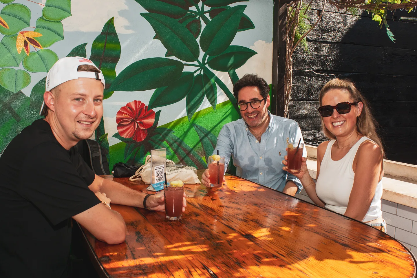 Guests sharing drinks on the rooftop