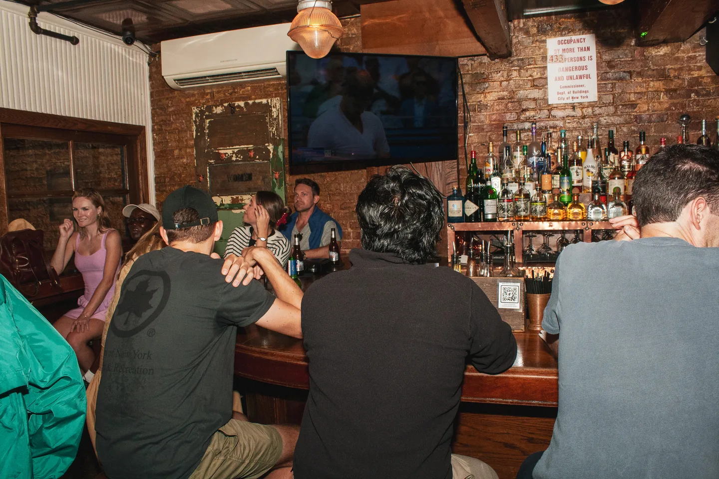 Guests watching the match from the bar