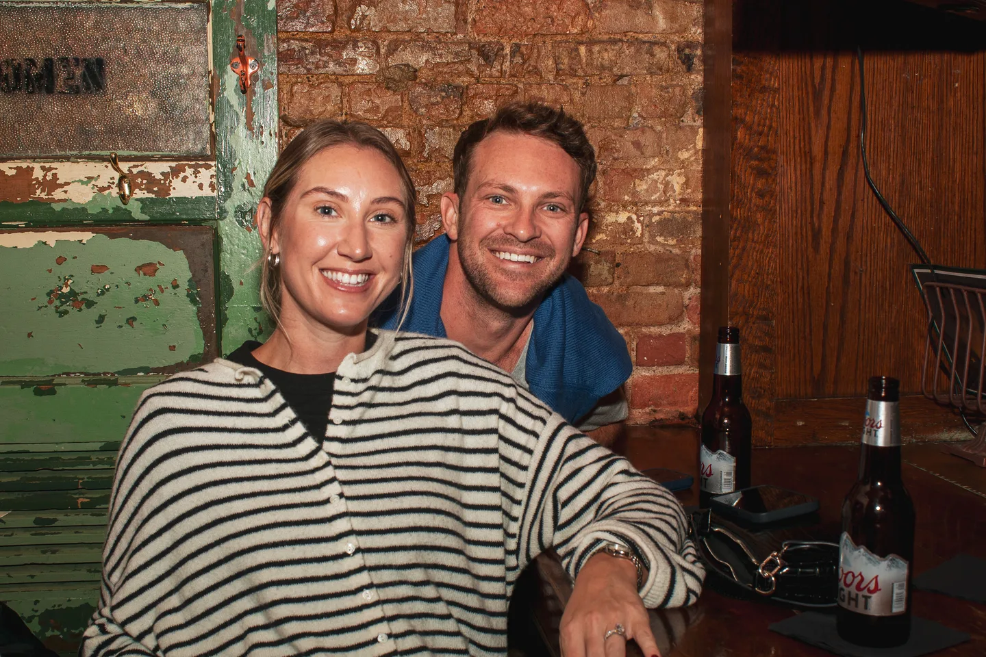 Two guests smiling together at the event
