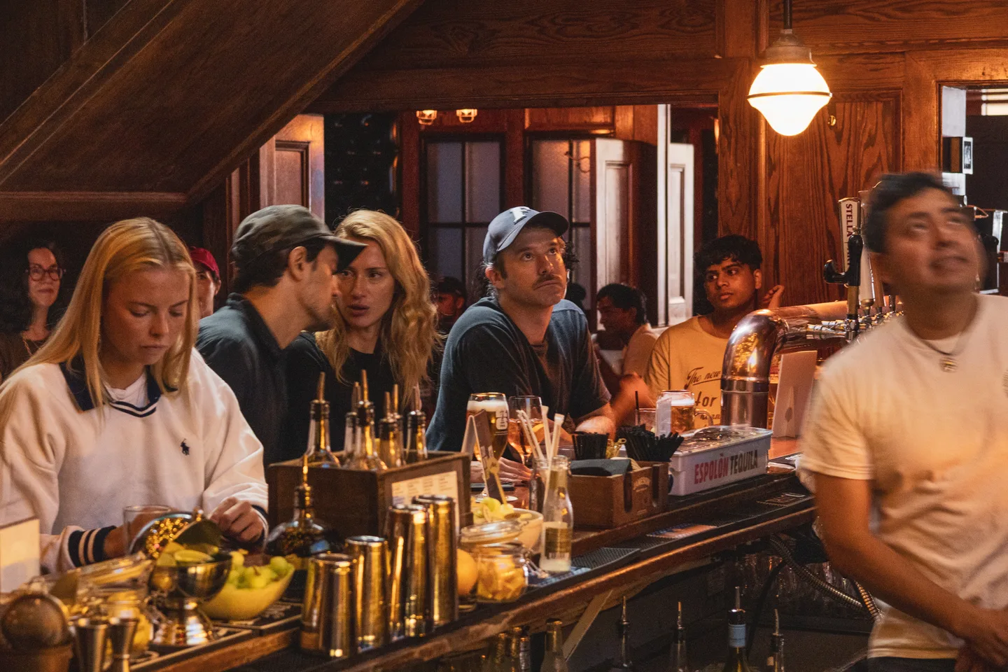 Guests seated at the bar during the watch party