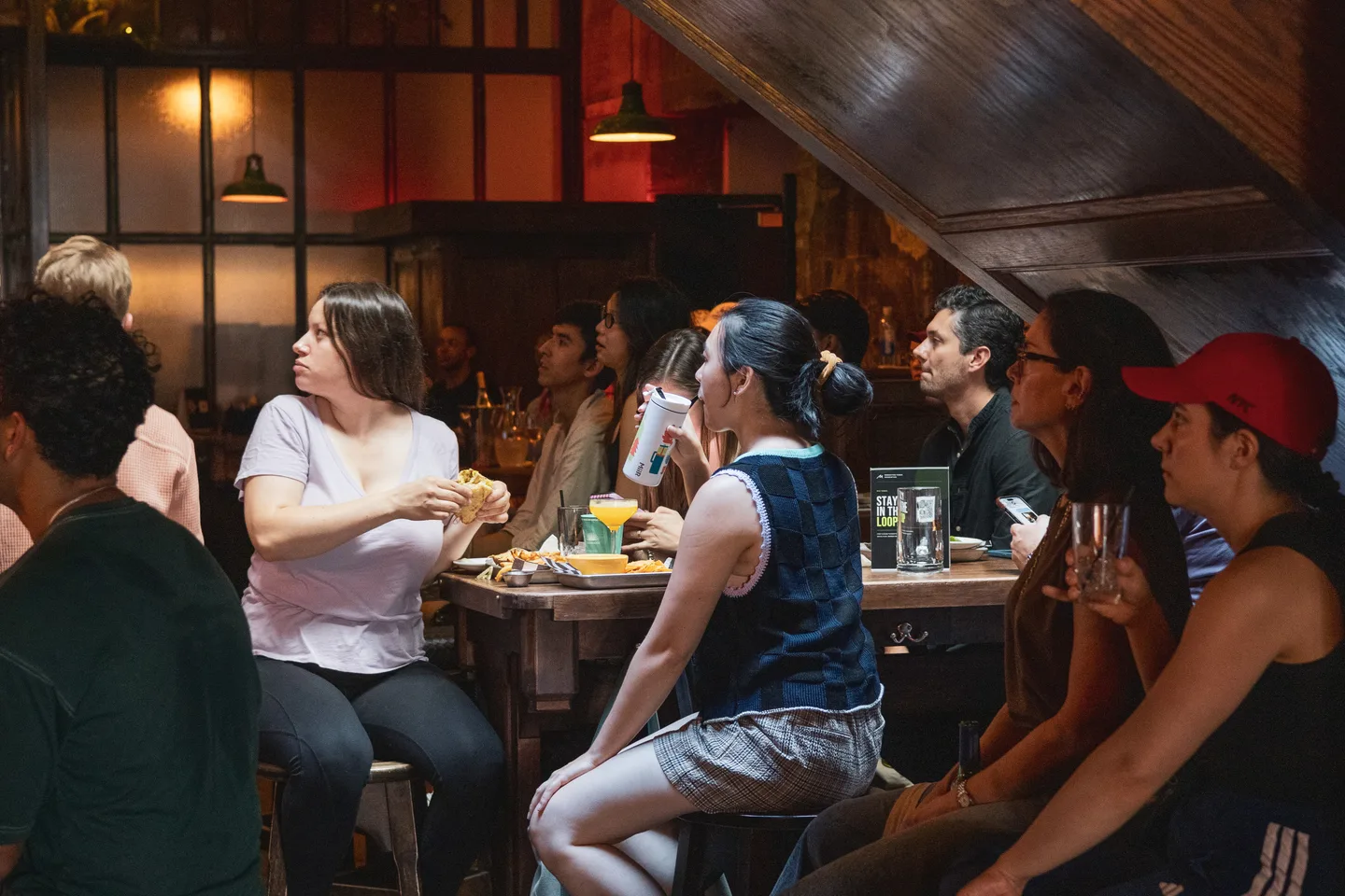 Guests sharing food and drinks inside the venue