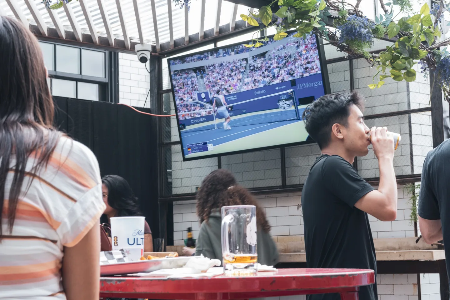 Guest watching the US Open men’s final on the rooftop television